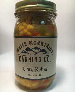 A jar of corn relish is shown on the table.