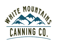 A white mountains canning company logo.