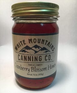 A jar of cranberry blossom honey is shown.