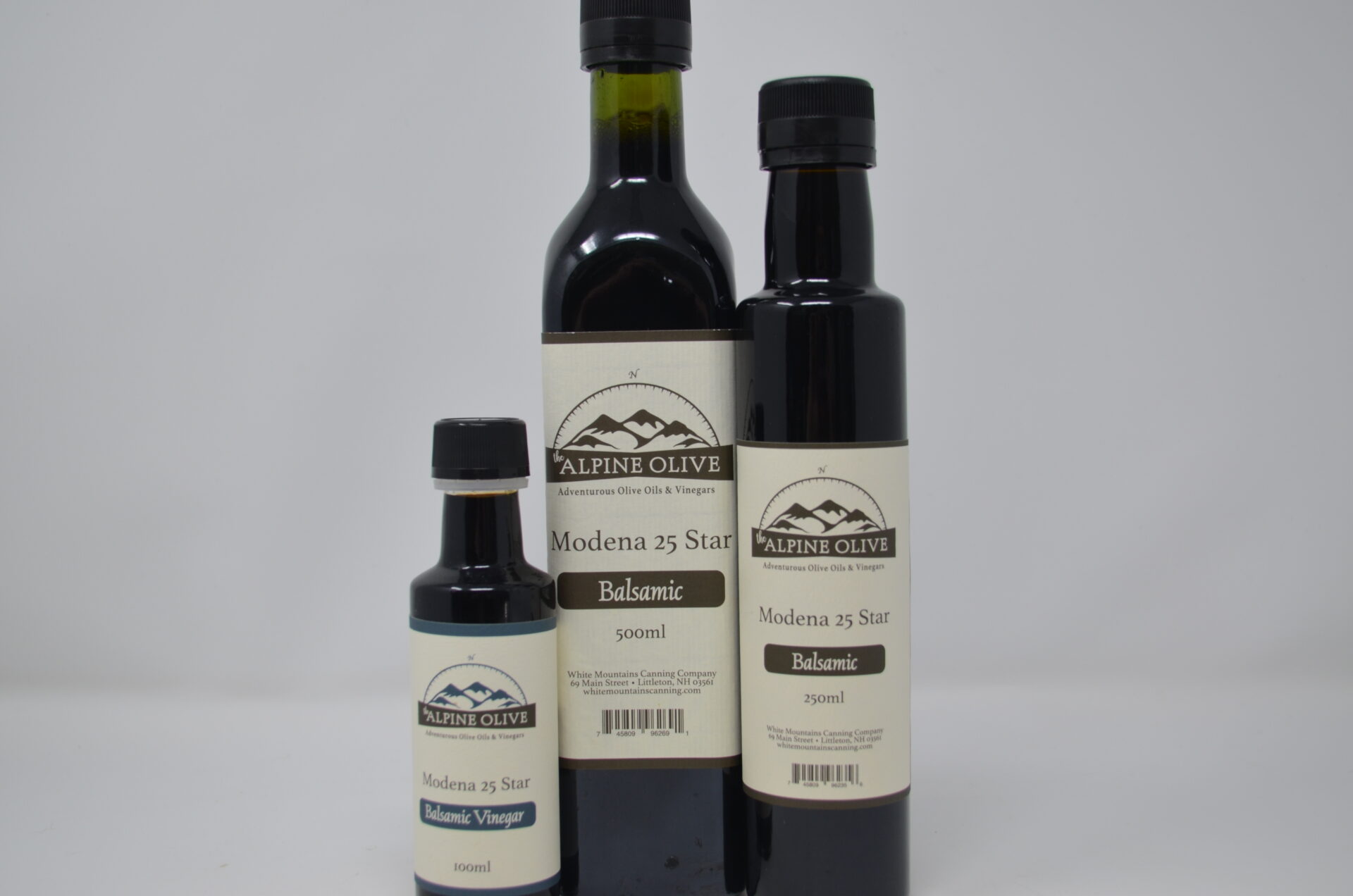 Three bottles of balsamic vinegar are shown.