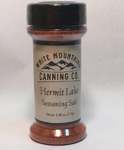 A jar of seasoning sits on the counter.