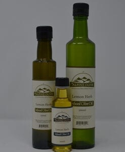 Three bottles of oil are shown with labels.