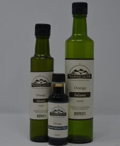 Three bottles of olive oil are shown with labels.
