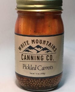A jar of pickled carrots is shown.