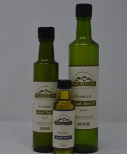Three bottles of olive oil are shown with labels.