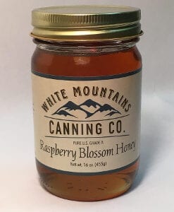 A jar of honey is shown with the label.