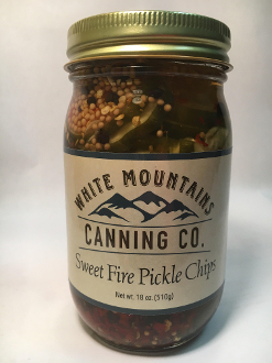 A jar of pickles with the label " sweet fire pickle chips ".