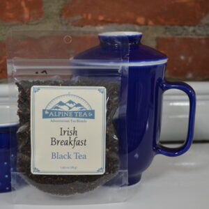 A bag of tea and a mug on the table.