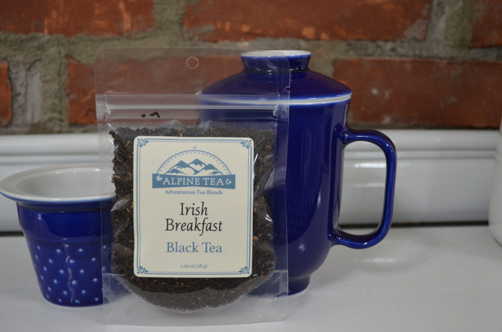 A bag of tea and a mug on the table.