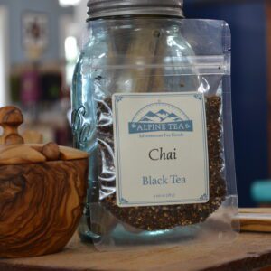 A jar of tea sitting on top of a table.