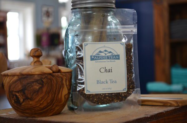 A jar of tea sitting on top of a table.