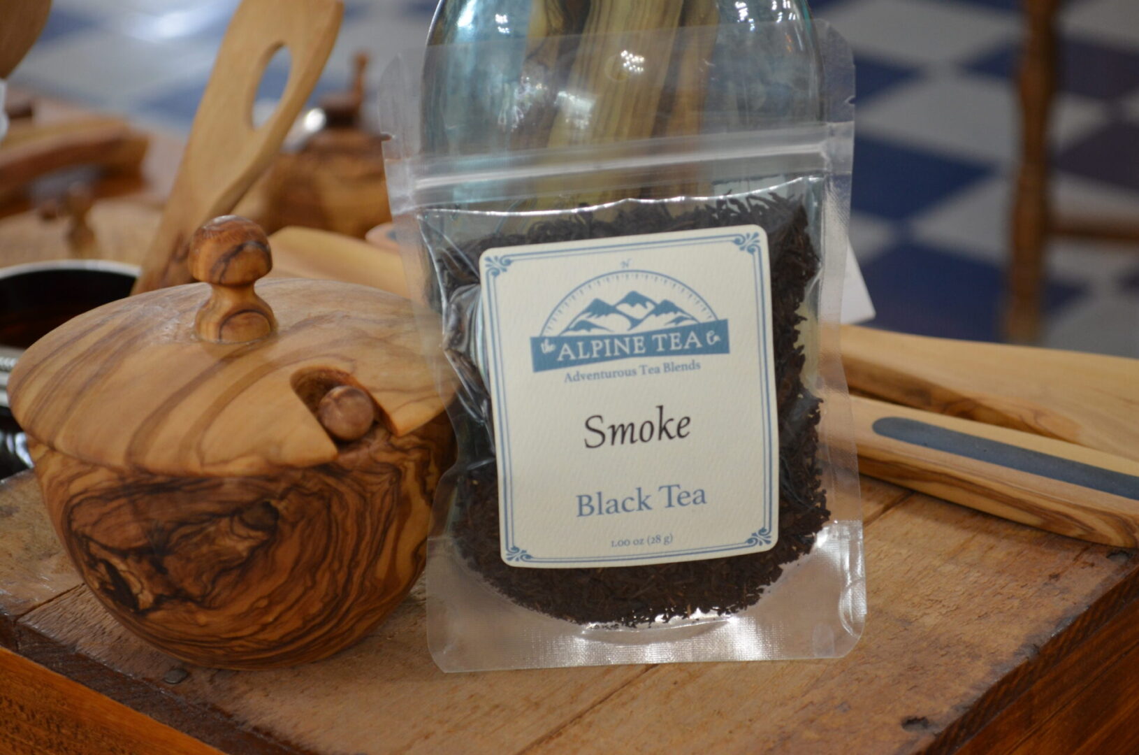 A bag of black tea on top of a table.