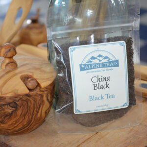 A bag of tea sitting on top of a wooden table.