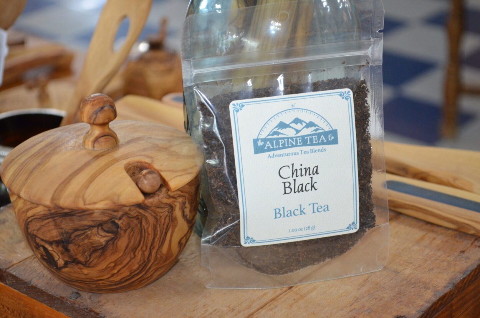 A bag of tea sitting on top of a wooden table.