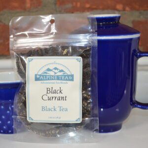 A bag of black currant tea sitting on top of a table.
