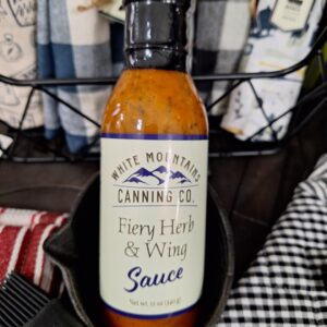 Fiery herb wing sauce in a bottle.