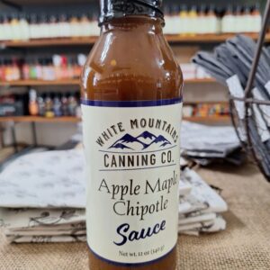 Apple Maple Chipotle sauce bottle on table.
