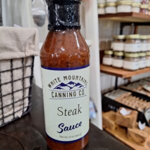 Steak sauce bottle on store shelf.
