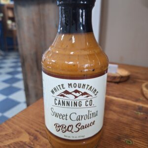 Sweet Carolina BBQ sauce on wooden table.