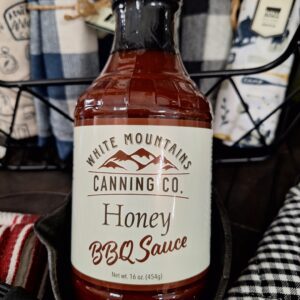Honey BBQ sauce bottle with checkered background.